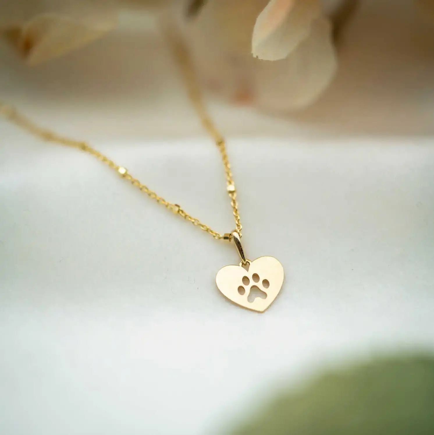 Anheng i gull Poten.