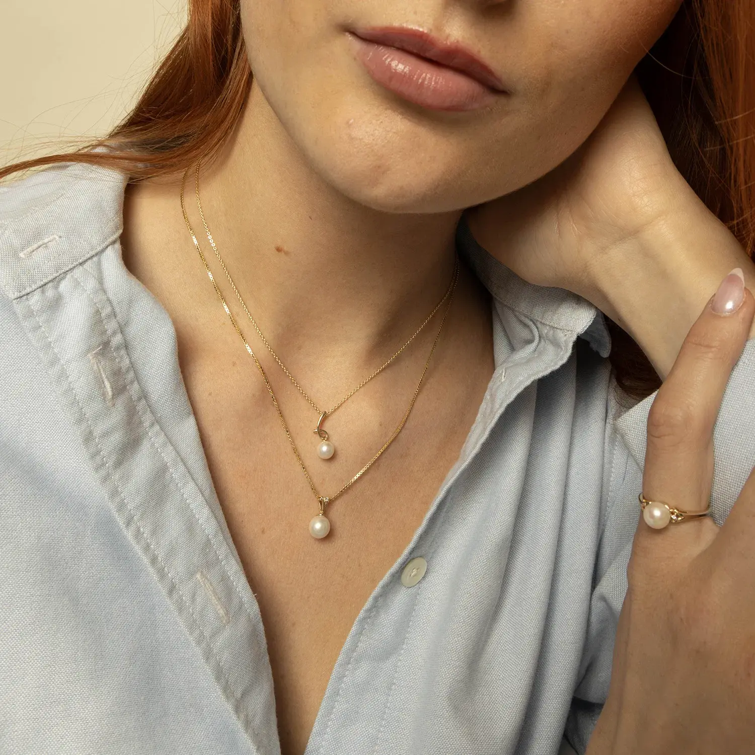 Smykke i gull med ferskvannsperle